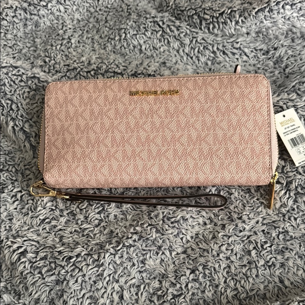 SOLD. New with tags!! Michael Kors Pink Wristlet Wallet